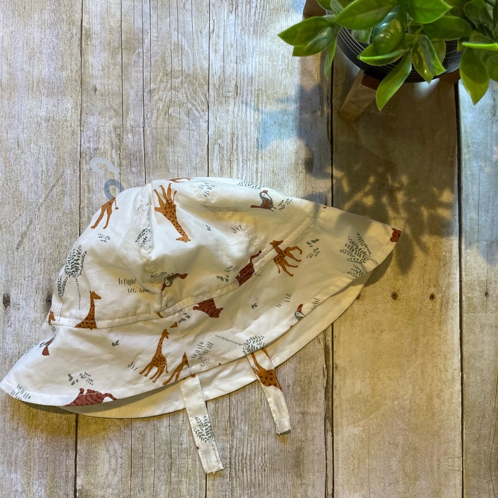 Carters - Safari Animal Print on Cream colored bucket hat with chin strap. 18 M